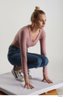  Kate Jones  1 blue jeans casual dressed kneeling pink long sleeve t shirt white sneakers whole body 0008.jpg